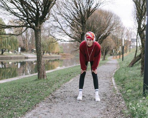 A person taking a short walking break in a park